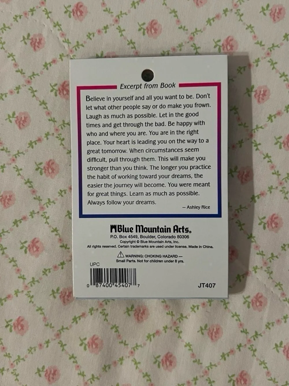 Miniature poetry book necklace.  “You are an amazing girl”.